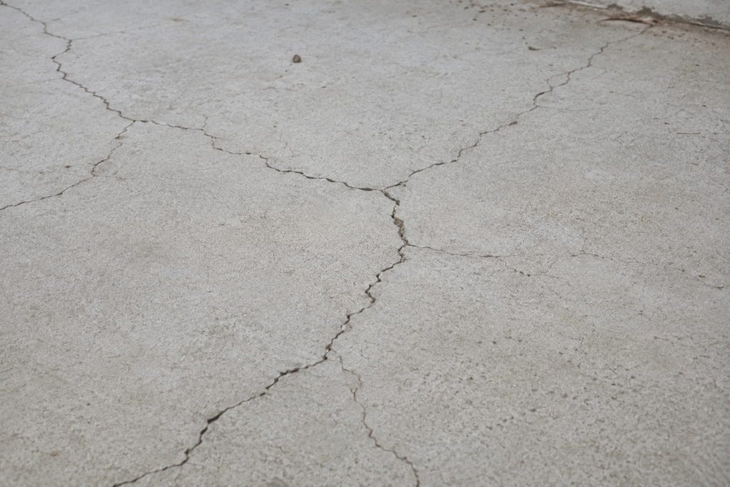 Concrete Curing Mistakes Cracks appearing in a slab of poorly cured concrete
